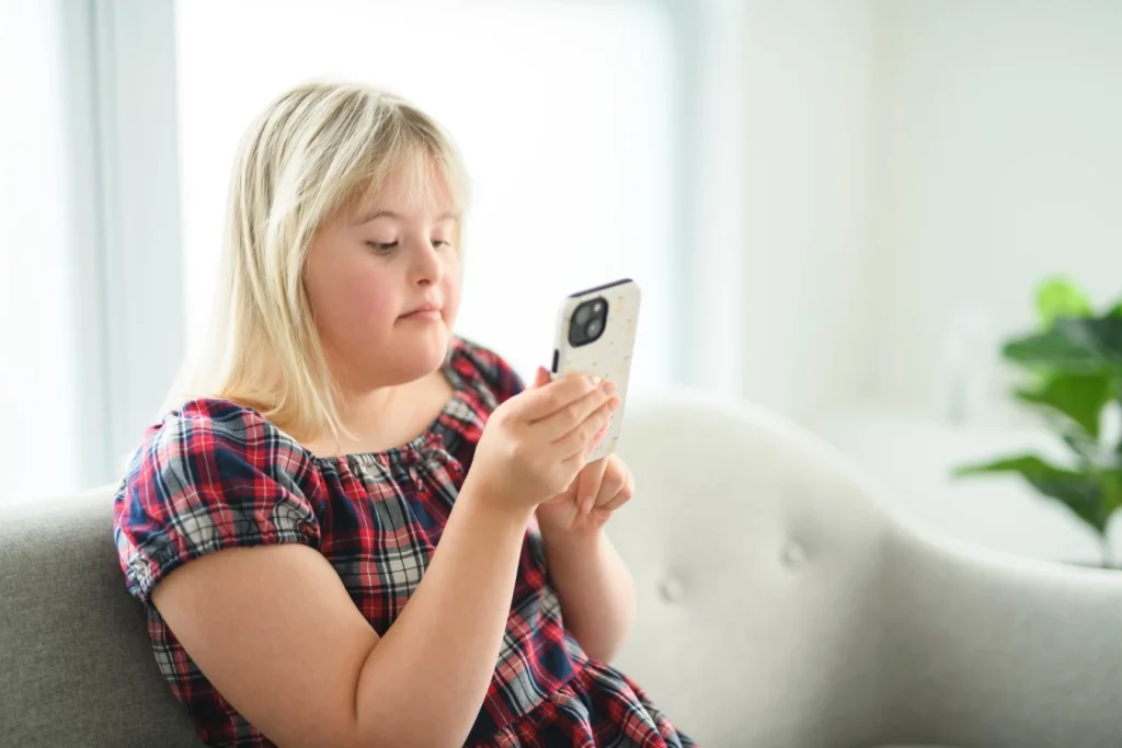 Disabled woman using phone to contact Care Inclusion